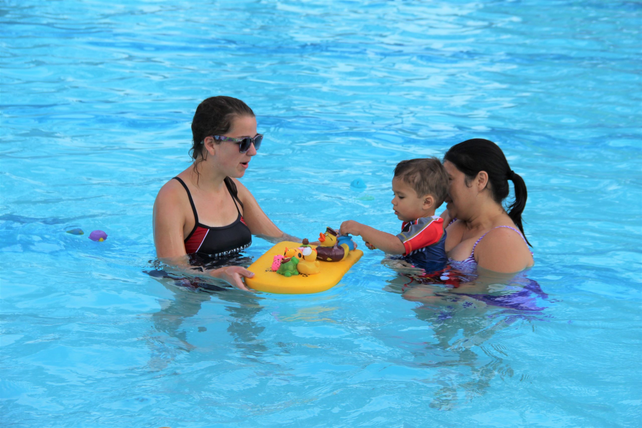 child and parent at a swim lesson