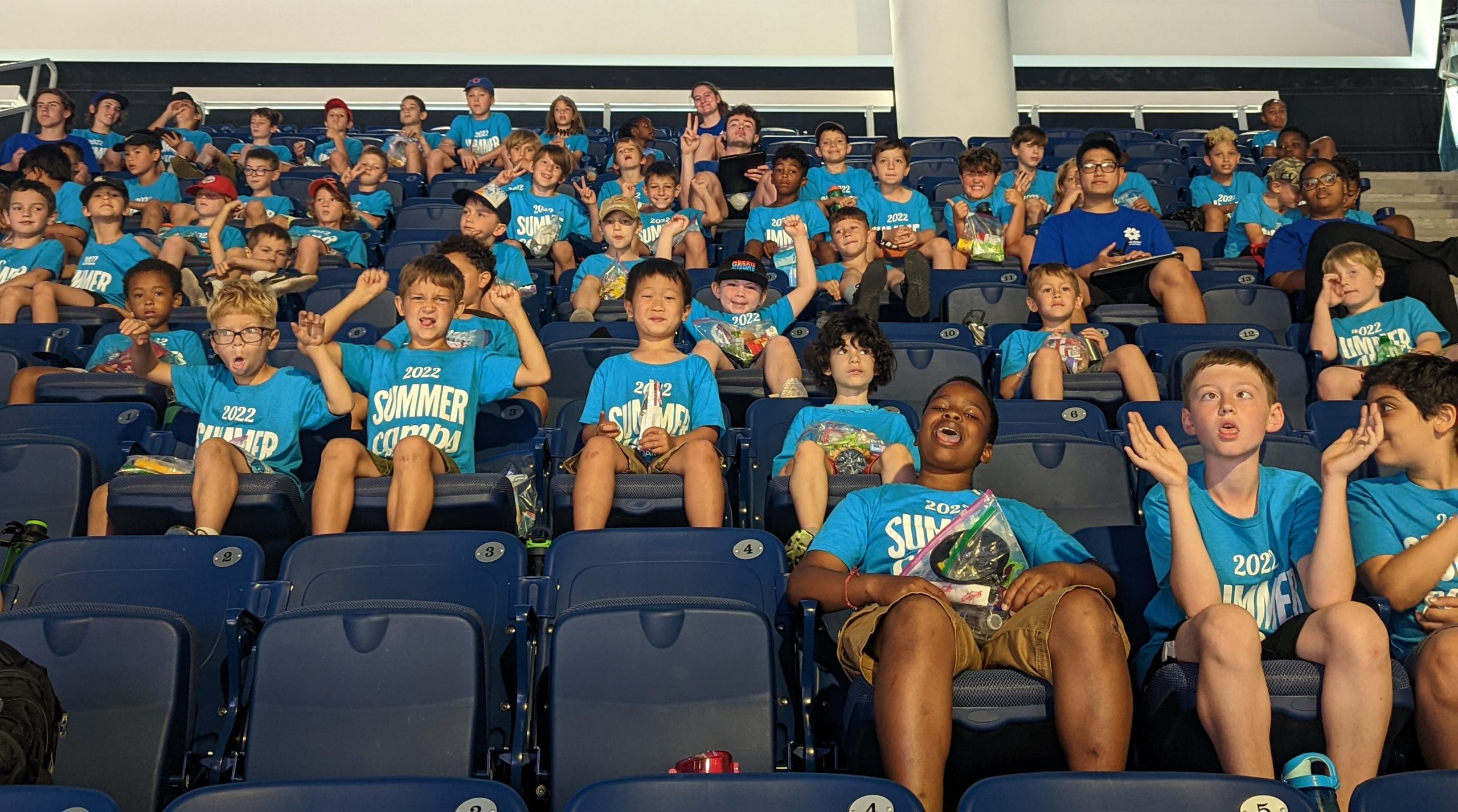 sports campers hang out at a sports game