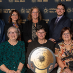 Park District of Oak Park leaders pose with National Gold Medal Award Finalist plaque