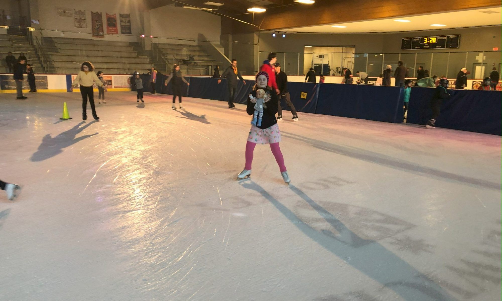 girl skates with her doll