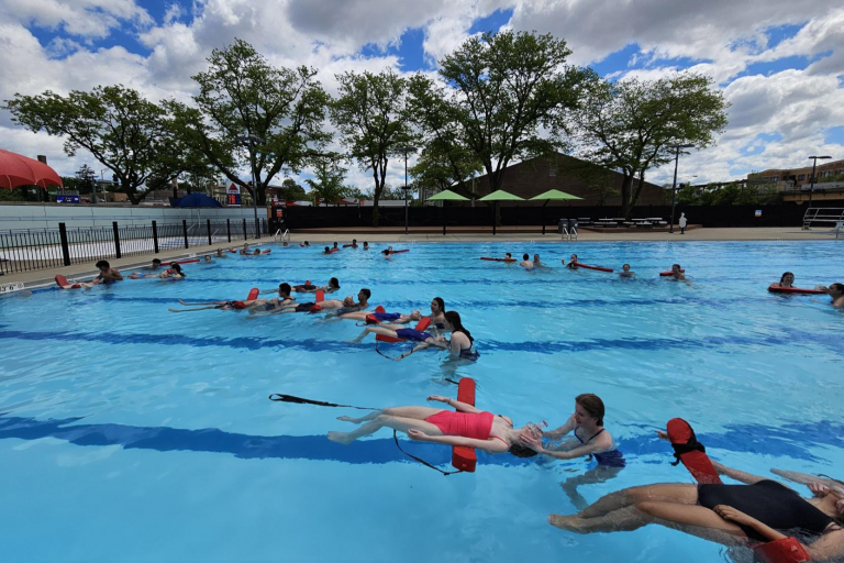 Lifeguards practice safety skills in the water