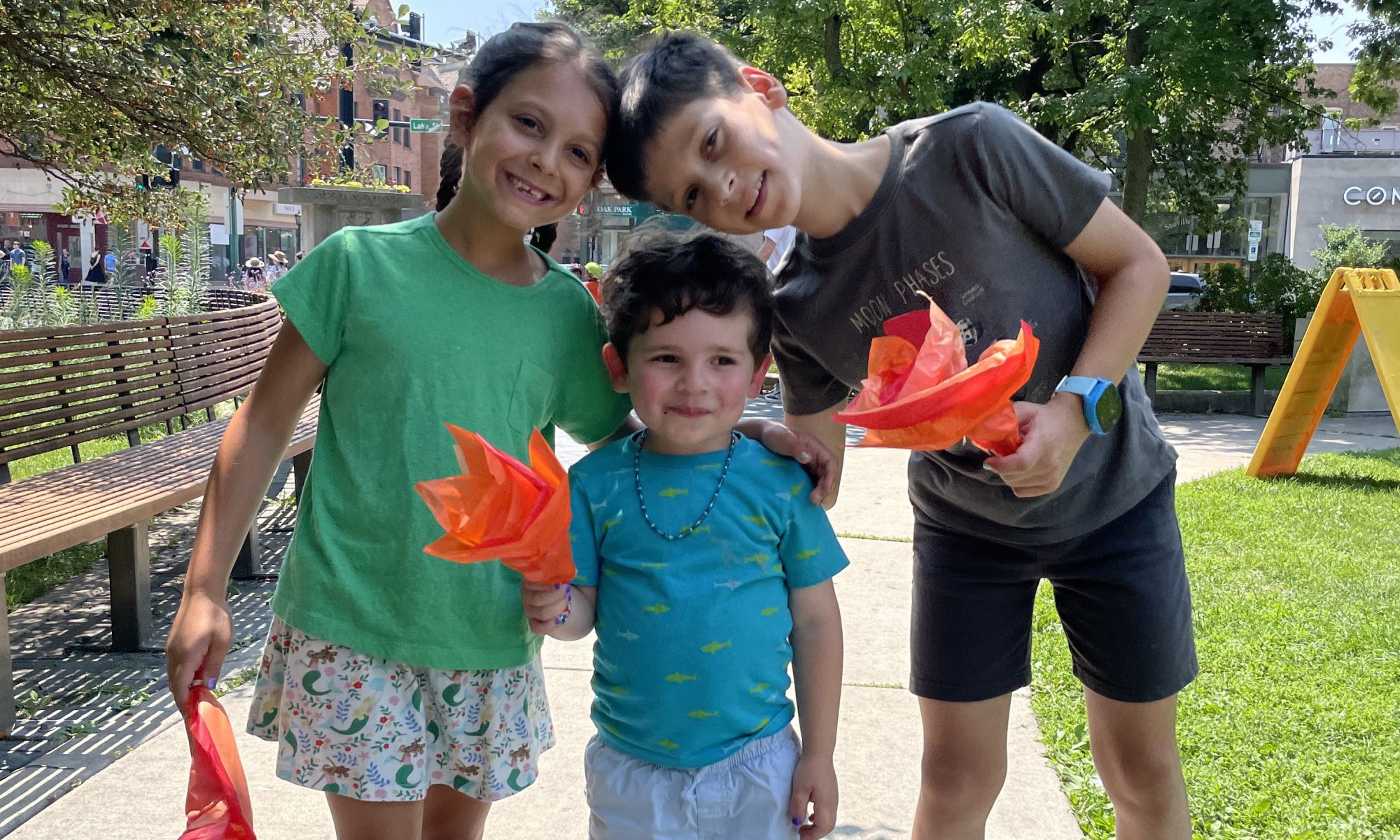 three kids smile at scoville park