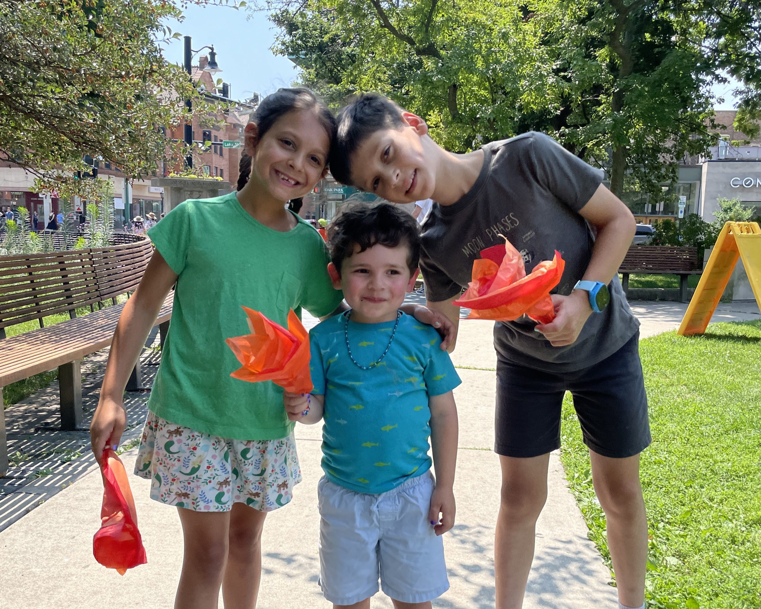 three kids smile at scoville park