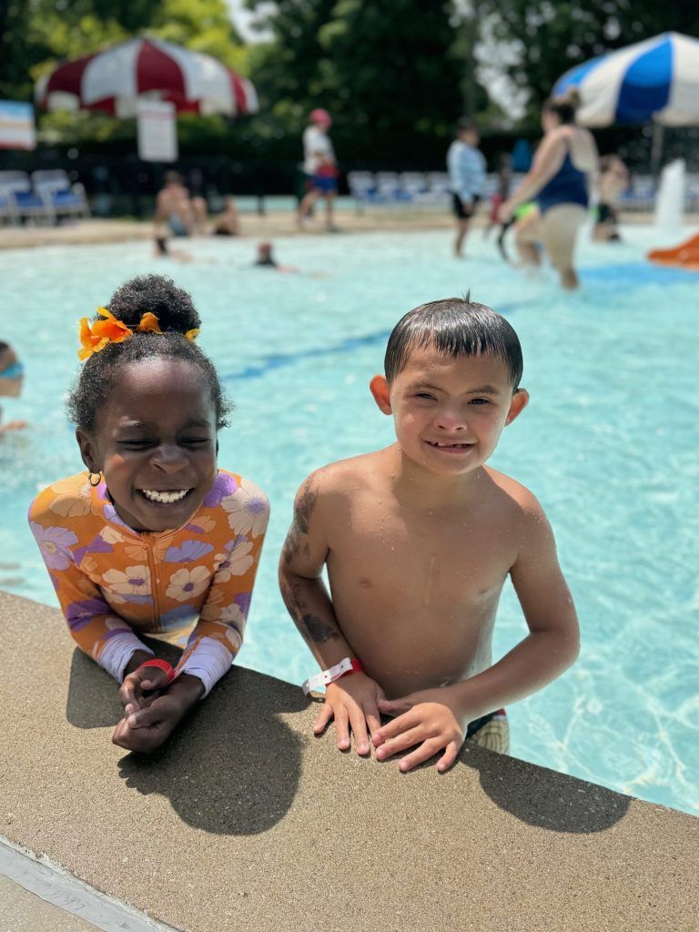 two friends swim at rehm pool