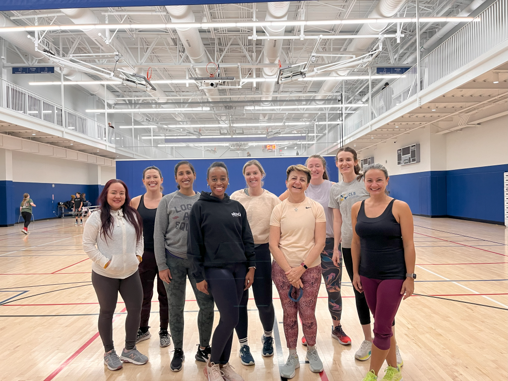 fitness instructor lorrie poses with werq fitness class participants