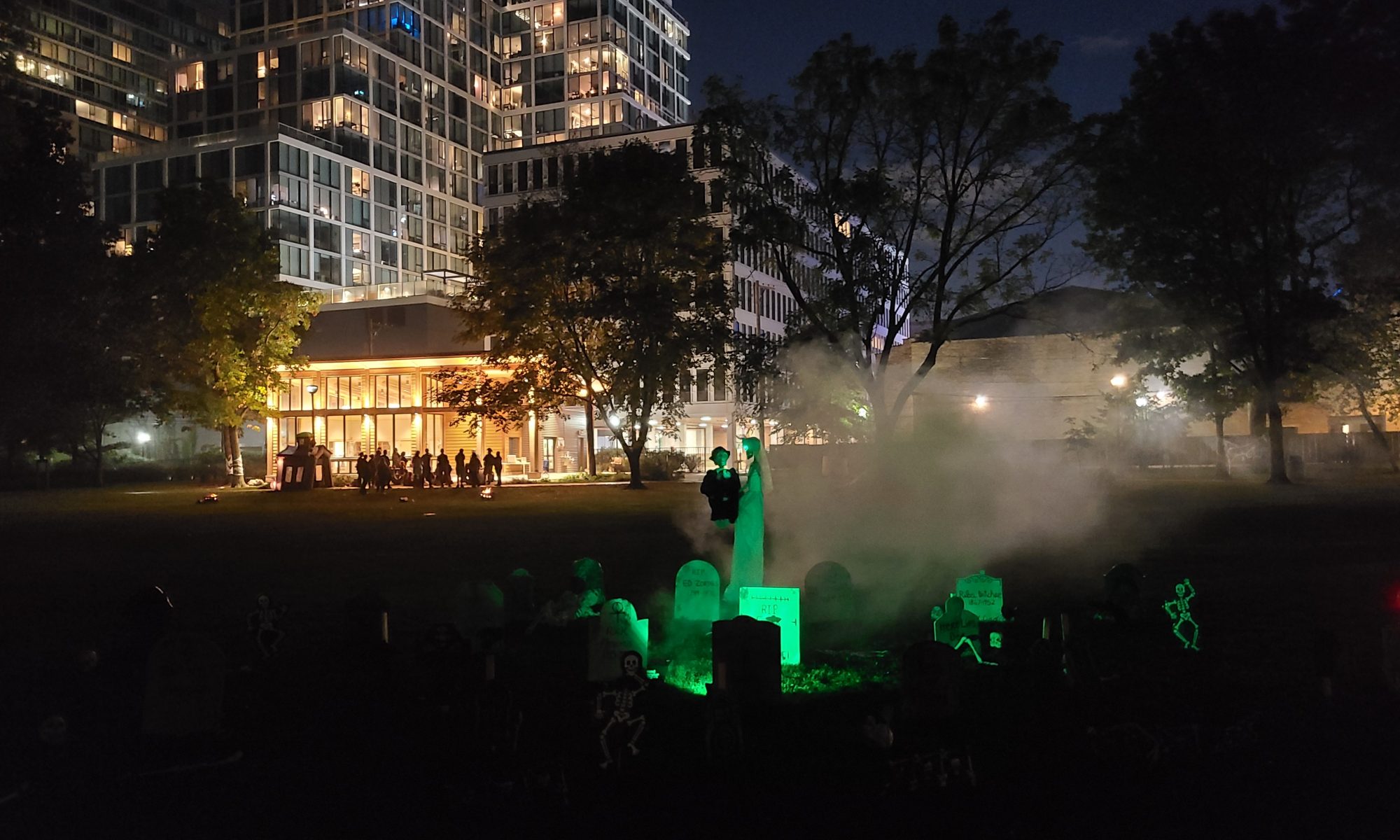 glowing graveyard in front of austin gardens at night