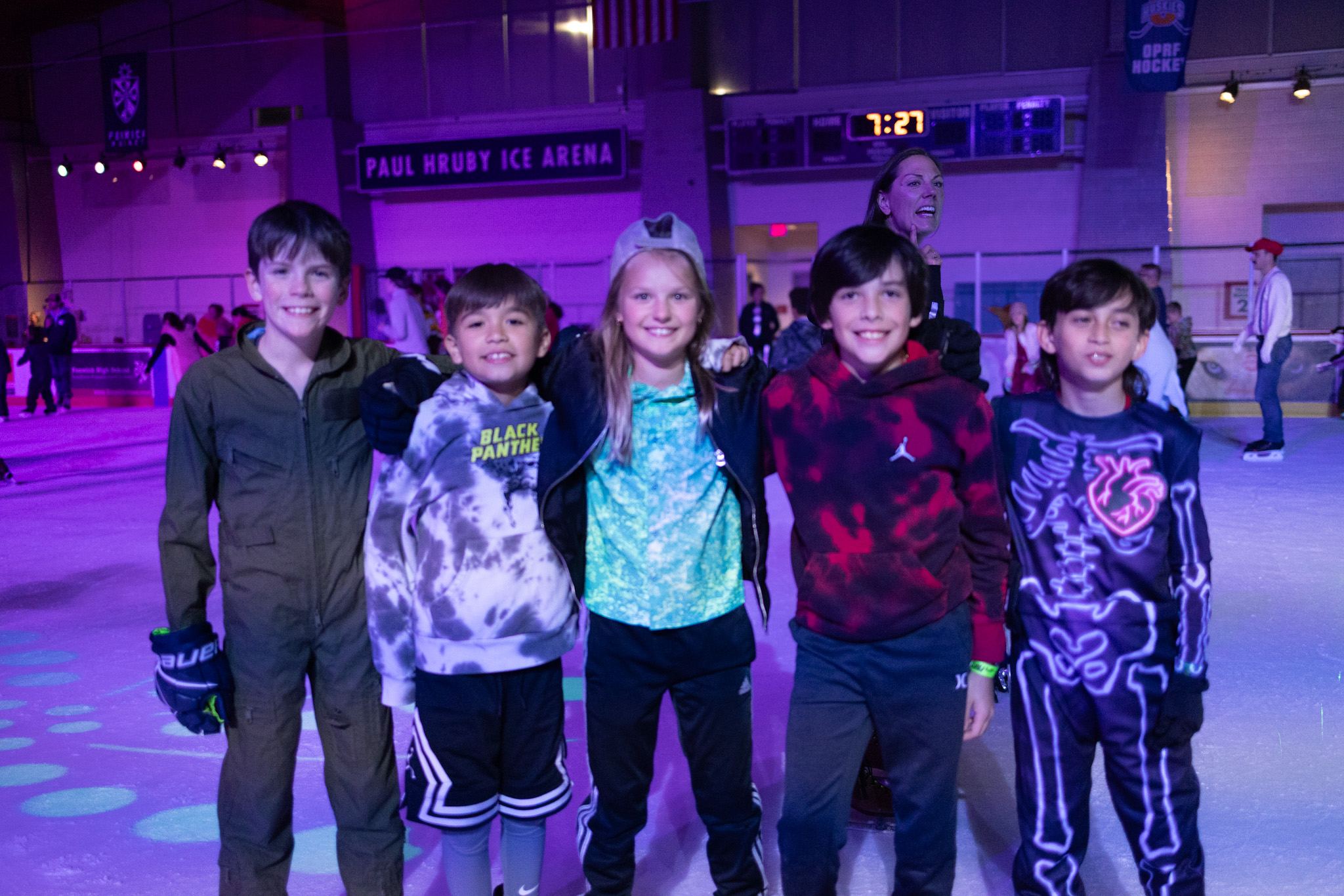 rink a group of tweens smile at the rink