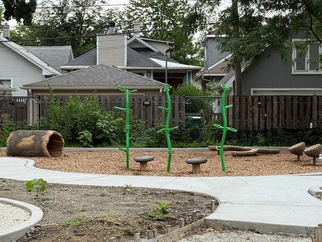 natural play area with logs and acorns at andersen park