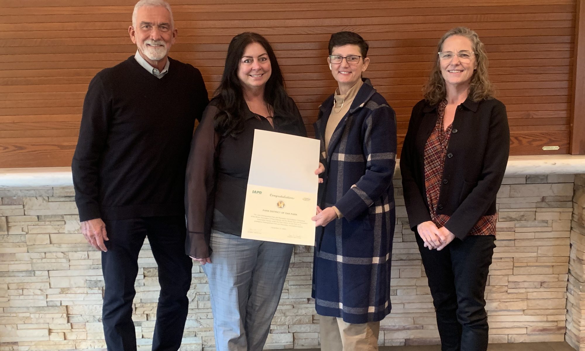 Park District staff pose with official Illinois Distinguished Agency Accreditation certificate