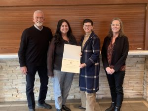 Park District staff pose with official Illinois Distinguished Agency Accreditation certificate