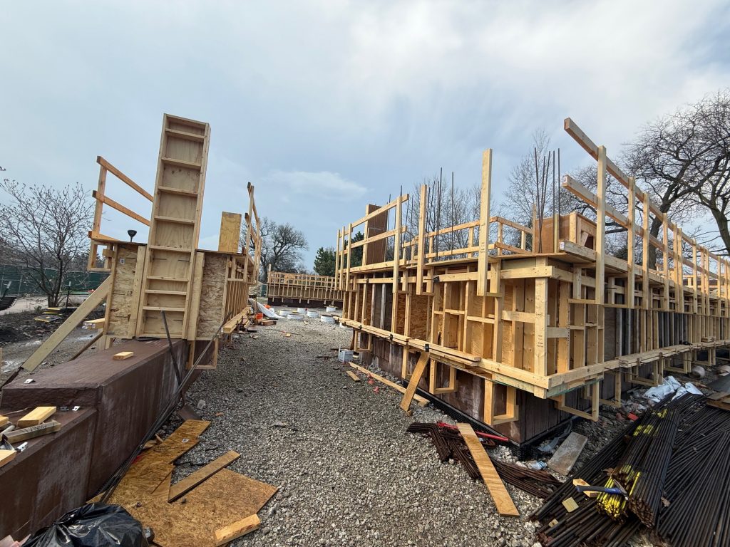 corner of field center with wood frames giving way to an opening on the corner